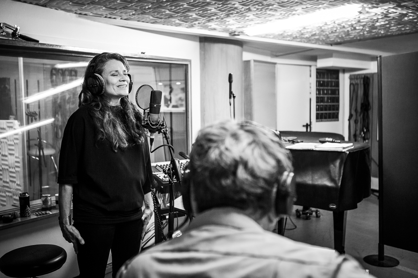 woman singing in a studio